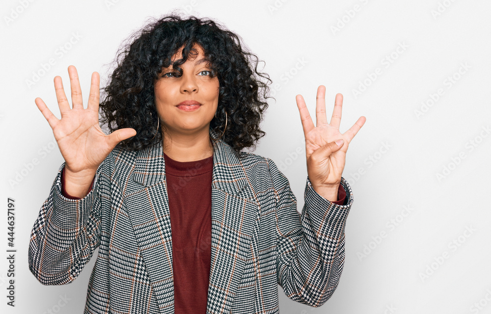 Young hispanic woman wearing business clothes showing and pointing up with fingers number nine while smiling confident and happy.