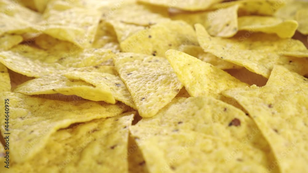 Heap of spicy corn tortilla chips. Close up. Dolly Shot Heap of spicy corn tortilla chips. Close up. Dolly Shot