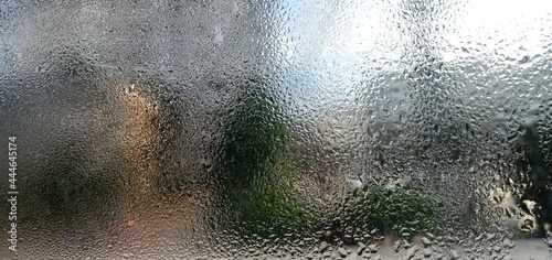 Drops of water on the glass background