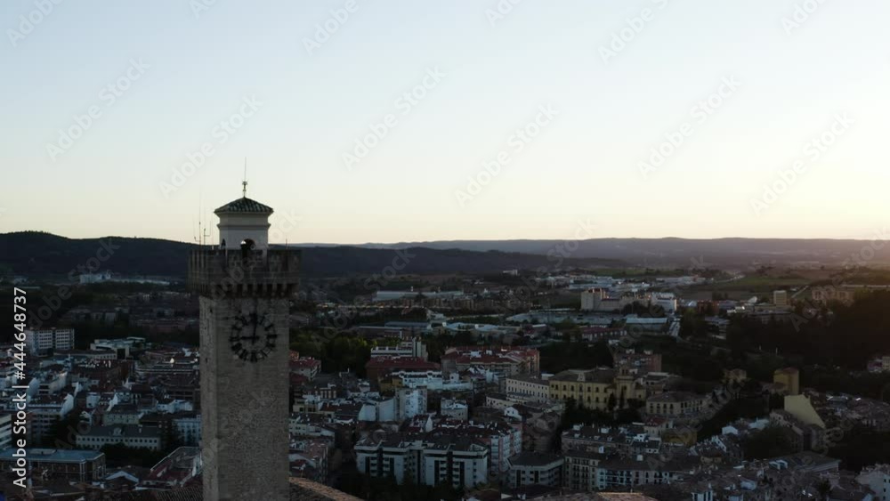 Tower Of Mangana Overlooking City Of Cuenca In Castile-La Mancha. Historical Landmark And Local Timekeeper In Spain. drone pullback Tower Of Mangana Overlooking City Of Cuenca In Castile-La Mancha. Historical Landmark And Local Timekeeper In Spain. drone pullback