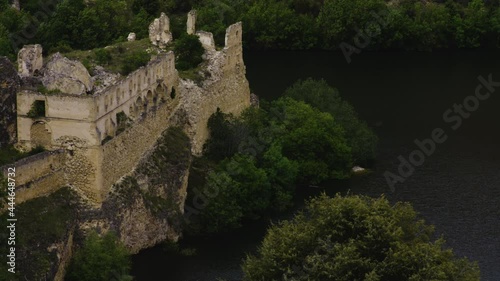 The Historic Convent Of Our Lady Of The Angels De La Hoz With Lush Green Trees And Calm River Duraton. Hoces del Rio Duraton Natural Park In Segovia, Spain. high angle, zoom-out photo