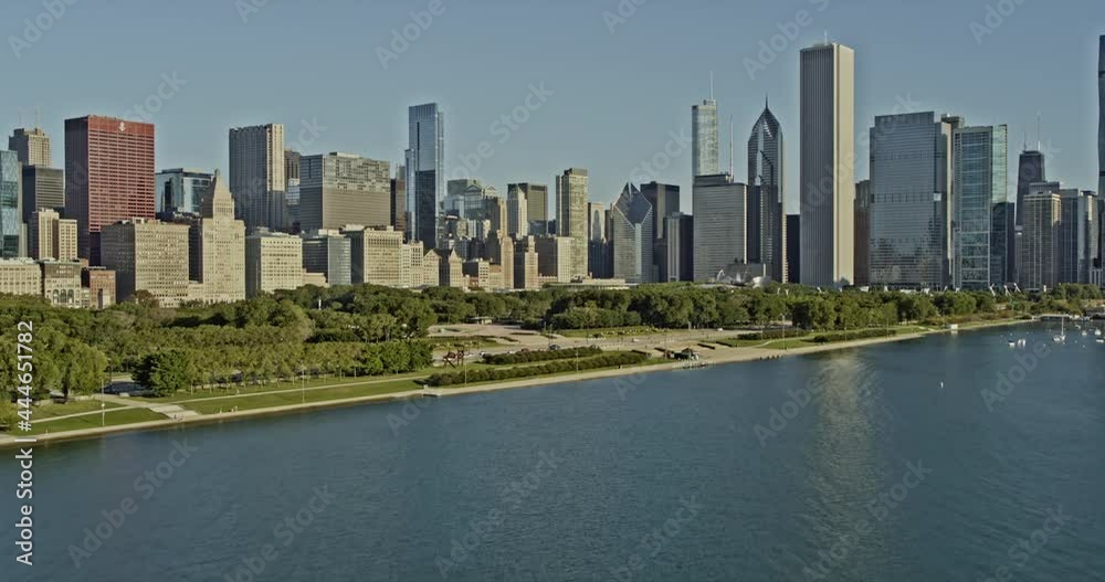 Chicago Illinois dramatic low level push in over the lake to Monroe Harbor Waterfront and through the city skyscrapers - 6k cinematic professional footage - August 2020 Chicago Illinois dramatic low level push in over the lake to Monroe Harbor Waterfront and through the city skyscrapers - 6k cinematic professional footage - August 2020