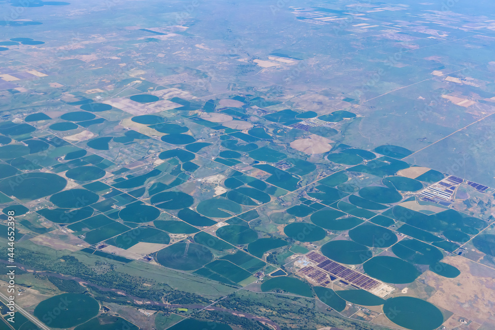 Aircraft view agriculture circled fields in the desert near Denver, Colorado, US