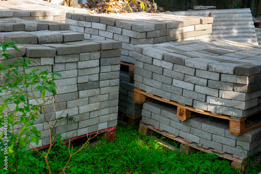 pile paving blocks on green grass in a garden pile paving blocks on green grass in a garden