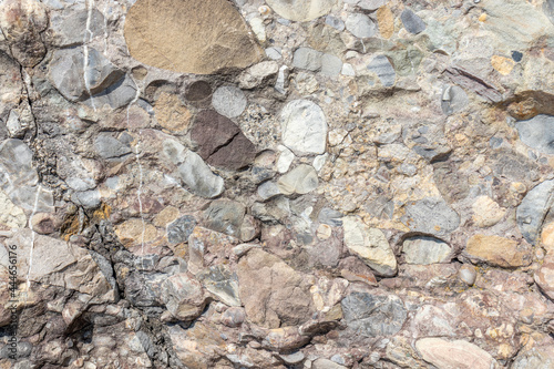 Closeup shot of conglomerate stone texture photo