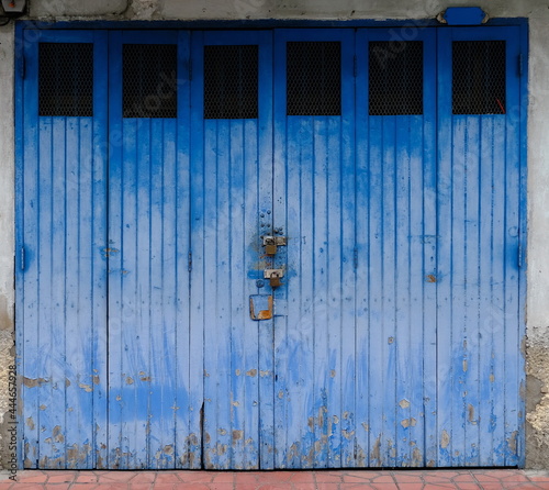 Vintage garage doors with padlock