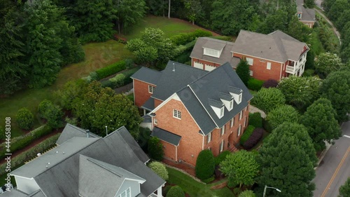 Upscale Southern brick 3-story home surrounded by private wooded forest. Exclusive upscale residence in USA. photo