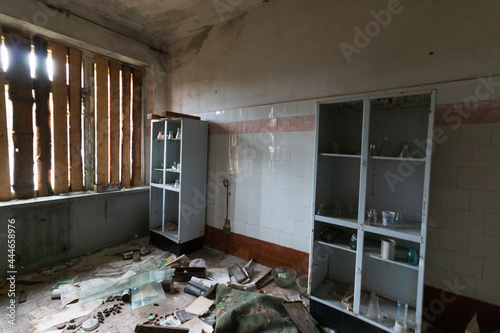 abandoned laboratory room with shelving