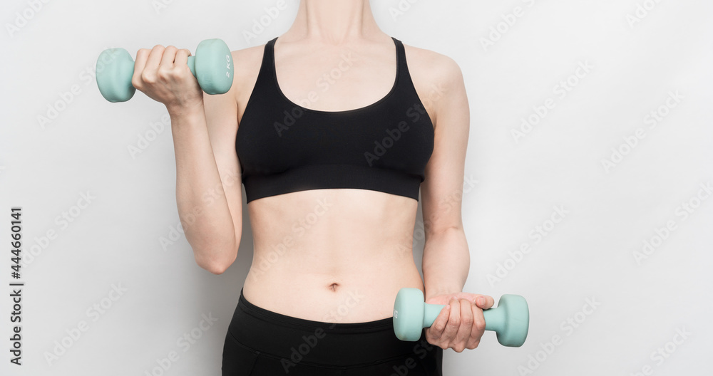 woman exercising with dumbbells woman exercising with dumbbells