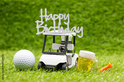 Photography Golf ball With Happy Birthday sign are on green grass background