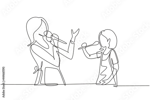 Single one line drawing cheerful mom and her little daughter singing while cooking together, using spatula and broccoli as microphones. Modern continuous line draw design graphic vector illustration