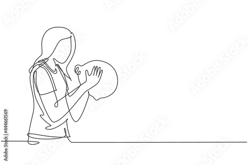 Single continuous line drawing beautiful young woman holding and kissing piggy bank. Wealth symbol and saving campaign concept for teenager. Dynamic one line draw graphic design vector illustration