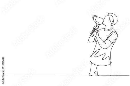 Continuous one line drawing young male athlete wearing jersey kissing trophy after winning world sports competition. A proud and unforgettable moment of victory. Single line draw design vector graphic