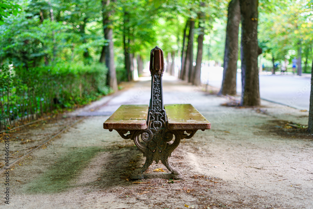 Old wooden bench to sit and rest in a park.
