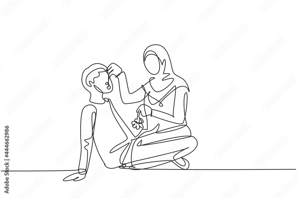 Single one line drawing romantic Arabian couple having picnic in park. Relaxing together sitting on the ground and women feeding grapes to men. Continuous line draw design graphic vector illustration