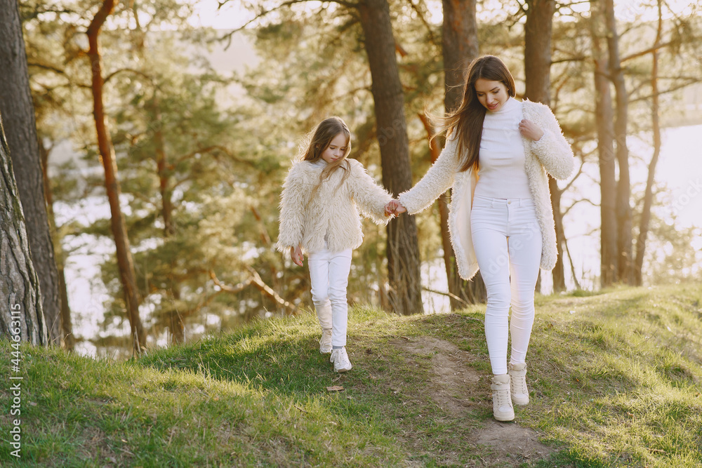 Fototapeta premium Elegant mother with daughter in a summer forest