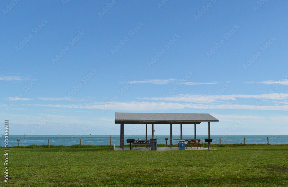 Wood beach fence along Key West beach picnic area in Florida, USA Wood beach fence along Key West beach picnic area in Florida, USA