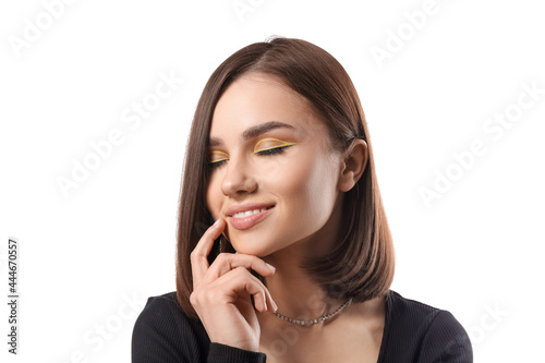 Beautiful young woman on white background