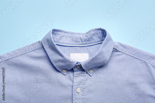 Stylish male shirt on color background