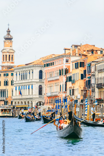 Venice, Italy - May 25, 2019: view of grand canal full of boats and gandolas rialto bridge on background © phpetrunina14