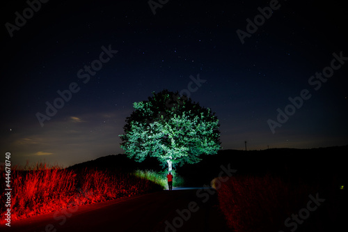 Countryroads illuminated colorfully past midnight photo