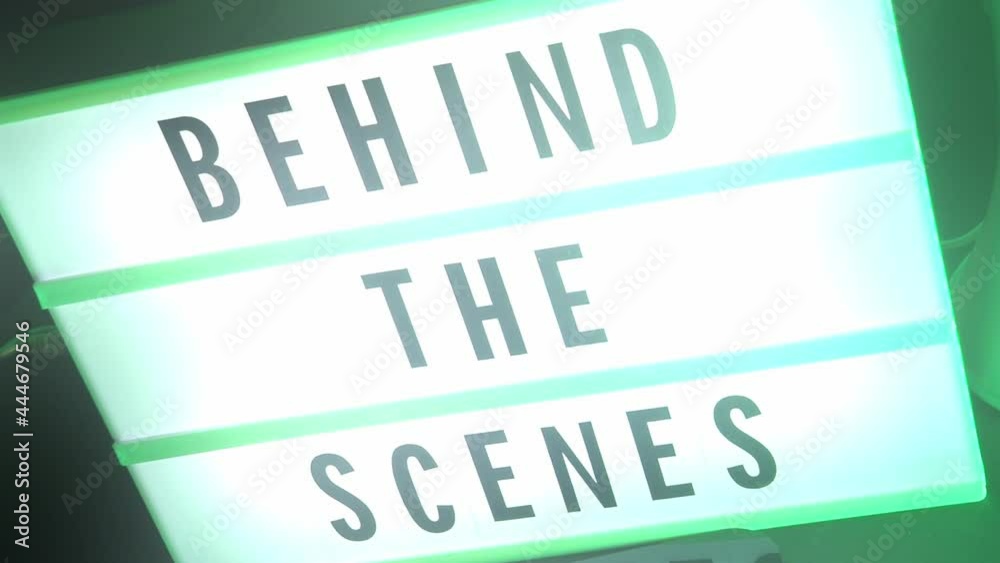 Behind the scenes lightbox in studio. letterboard text lightbox. Color light changing. Cinema Light box beside movie slate clapperboard megaphone and director chair. video production Behind the scenes