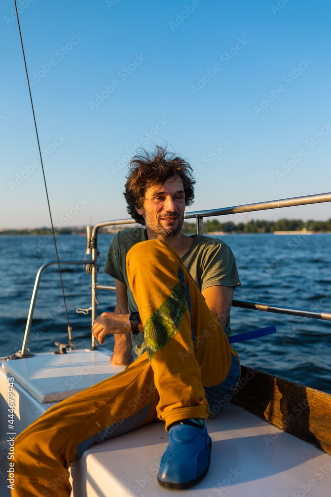 portrait of a laughing man on a yacht portrait of a laughing man on a yacht