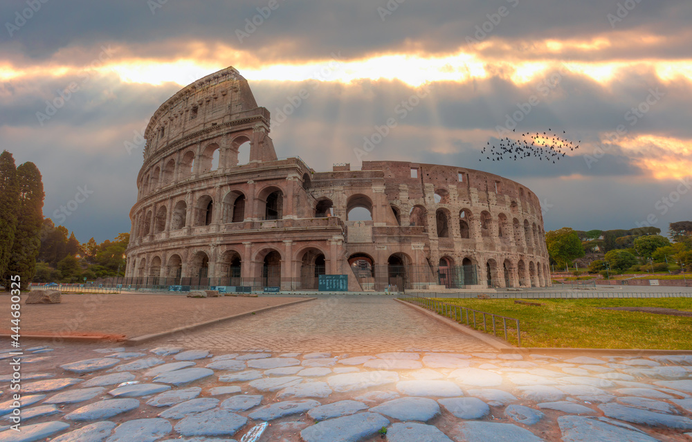 View of Colosseum in Rome and morning sun - Rome Colosseum is one of the main attractions of Rome