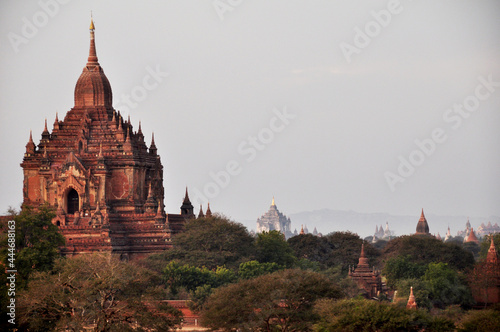 View landscape with silhouette chedi stupa of Bagan or Pagan ancient city and UNESCO World Heritage Site with over 2000 pagodas and temples evening twilight dusk time in Mandalay of Myanmar or Burma