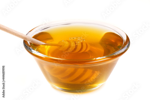 Miód pszczeli w słoiku na białym tle