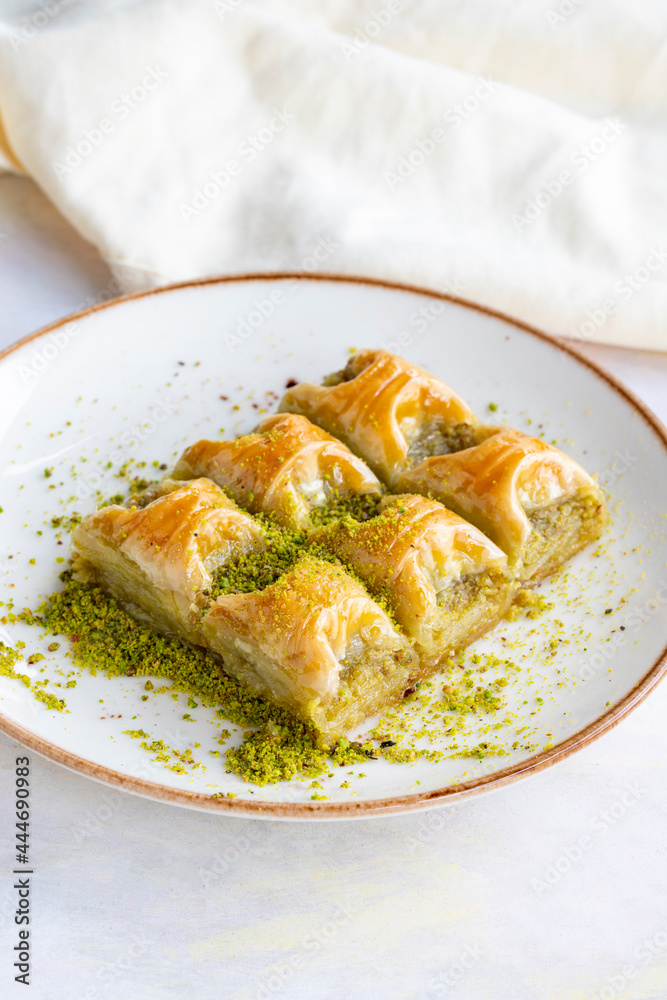 Pistachio baklava. Baklava with pistachio on a white background. Local name cimcik baklava Pistachio baklava. Baklava with pistachio on a white background. Local name cimcik baklava