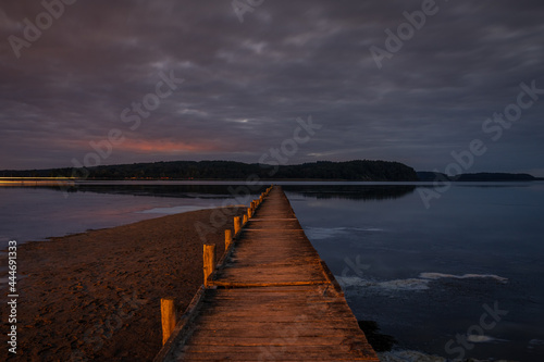 The Jasmunder Bodden coast after dark  with the pier in Lietzow  Mecklenburg-Western Pomerania  Germany