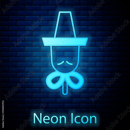 Glowing neon Traditional korean hat icon isolated on brick wall background. Vector