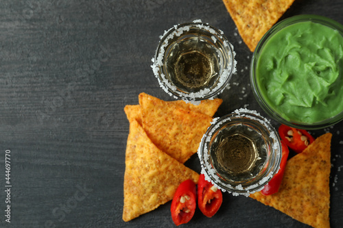 Party concept with tequila, guacamole and chips