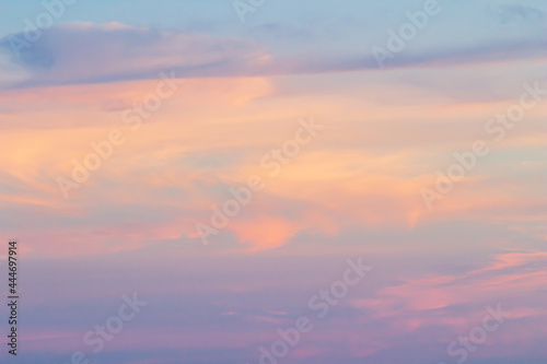 Sunset sky background with pink, purple and blue dramatic colorful clouds, vast sunset sky landscape © SINSU1980