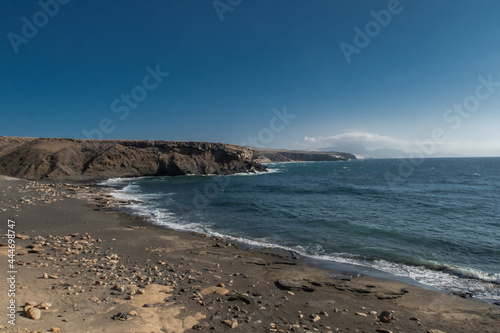 Fuerteventura beach with cliffs and stones