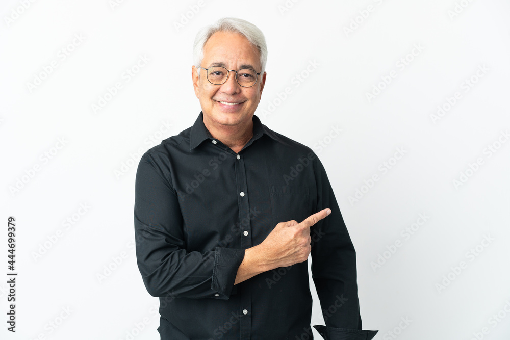 Middle age Brazilian man isolated on white background pointing to the side to present a product Middle age Brazilian man isolated on white background pointing to the side to present a product
