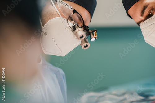 Tableau sur toile Medical surgeon team operating patient in surgical room at private clinic - Focu