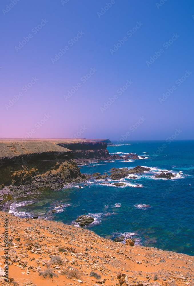 Fototapeta premium Ocean shore minimalist background. Ideal for postcard prints, phone cases, print t-shirts. Canary islands. Fuerteventura. Stylish nature visual spirits wallpaper