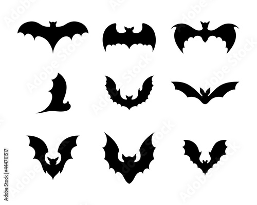 Set of black silhouettes of bats. Creepy decoration of horror design for Halloween party. Spooky background for october night party and invitations. Flat vector stock illustration.