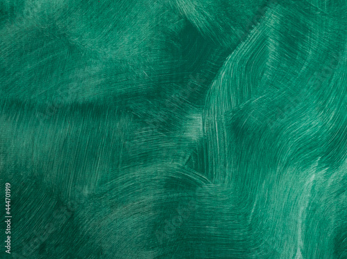 Background texture of a wall painted in green. Textured brush strokes. A wall with thin, irregular stripes.
