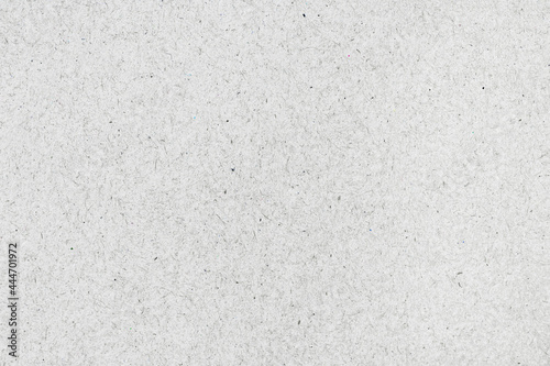 White textured background, cardboard sheet. Copy space