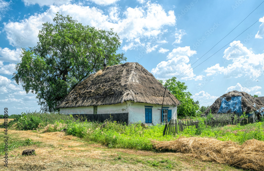 Old abandoned clay house with thatched roof Old abandoned clay house with thatched roof
