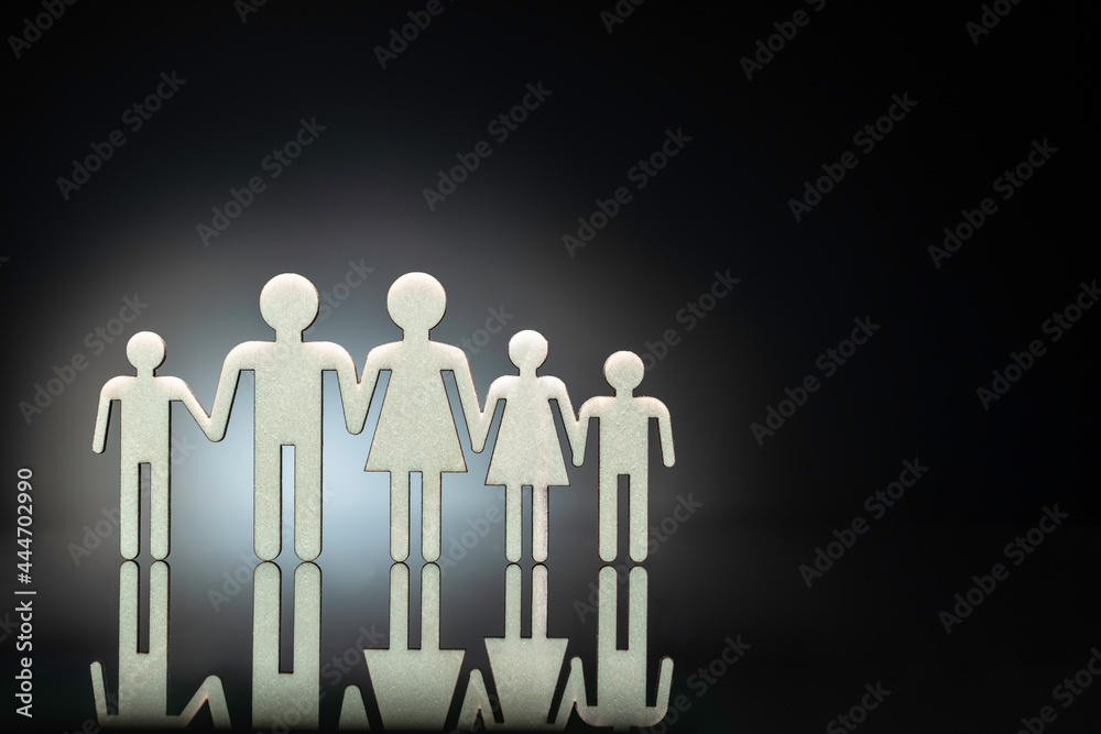 2D FAMILY SYMBOL made on plywood and placed on reflexive glass on black background running as TEAMWORK. 2D FAMILY SYMBOL made on plywood and placed on reflexive glass on black background running as TEAMWORK.