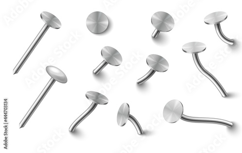Set of metal nails hammered in wall bend with round steel caps top and side view