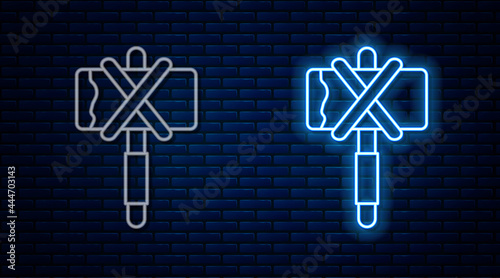 Glowing neon line Medieval axe icon isolated on brick wall background. Battle axe, executioner axe. Medieval weapon. Vector