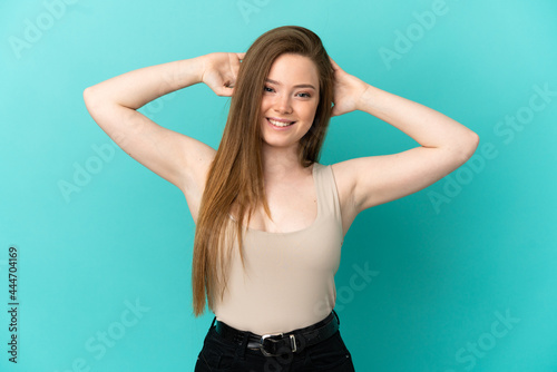 Teenager girl over isolated blue background laughing