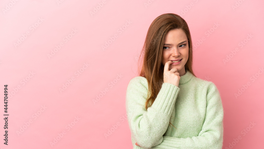 Teenager girl over isolated pink background nervous and scared Teenager girl over isolated pink background nervous and scared