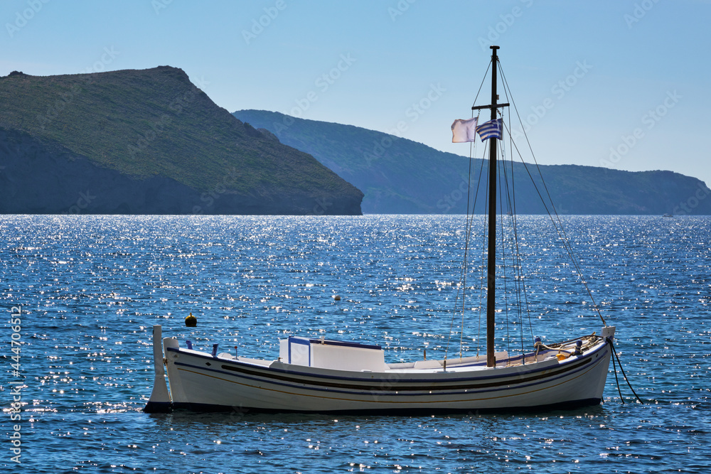 Traditional greek fishing boat in the aegean sea, Greece.