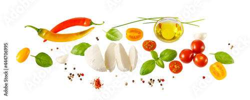 Mozzarella, cherry tomatoes, basil, olive oil, garlic, chilli red pepper, green onion for caprese salad or bruschetta